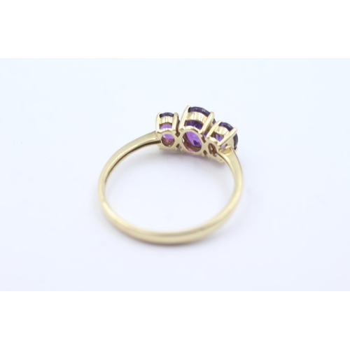 157 - 9ct gold amethyst trio ring (2.7g)  Size  W