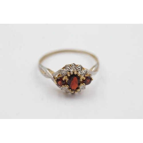 159 - 9ct gold diamond & garnet fronted ring (2.1g)  Size  U