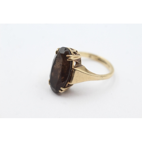 166 - 9ct gold smokey quartz dress ring (4.6g)  Size O