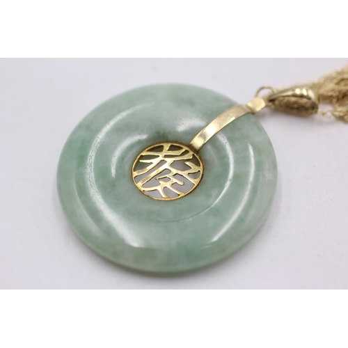 184 - 14ct gold jade pendant on chain (8.6g)