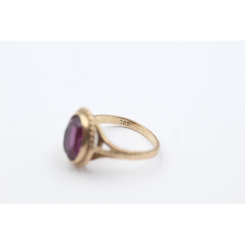 196 - 9ct gold amethyst rope framed ring (2.4g)  Size H