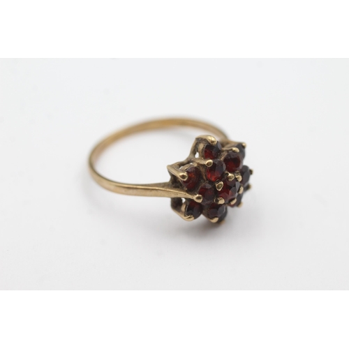 244 - 9ct gold garnet floral set ring (2.5g)  Size Q