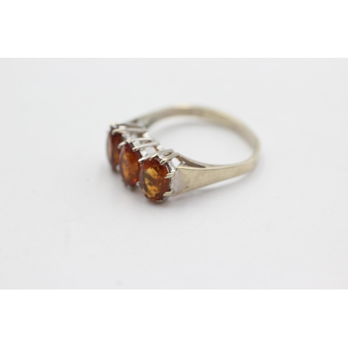 247 - 9ct gold citrine trio fronted ring (2.9g)  Size  L