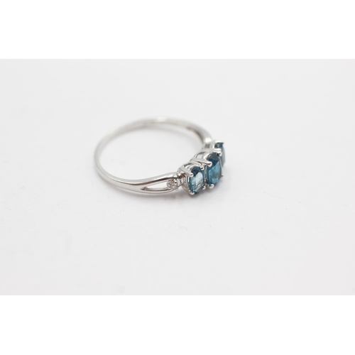 253 - 9ct white gold diamond & topaz fronted ring (1.5g)  Size  O