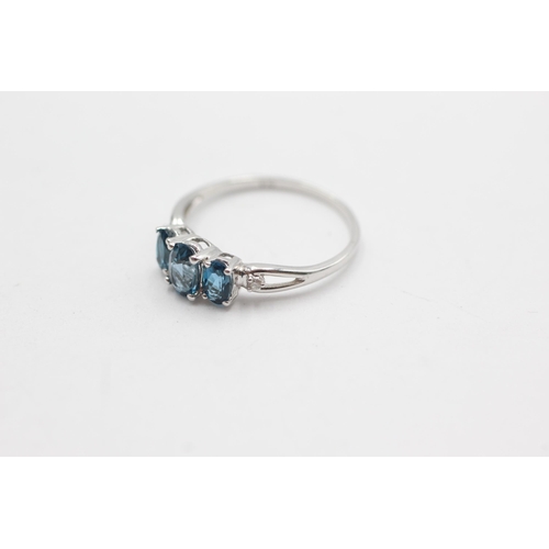 253 - 9ct white gold diamond & topaz fronted ring (1.5g)  Size  O