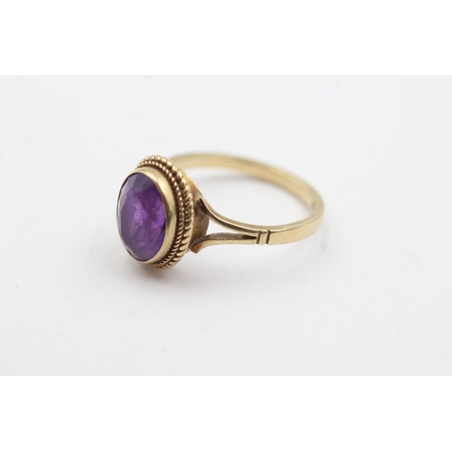 255 - 9ct gold amethyst rope framed ring (2.8g)  Size  M