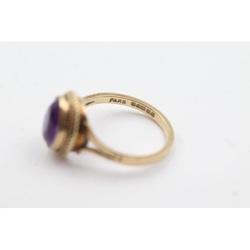 255 - 9ct gold amethyst rope framed ring (2.8g)  Size  M