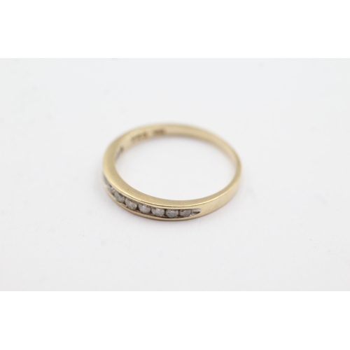 256 - 9ct gold diamond fronted band ring (1.3g)  Size L