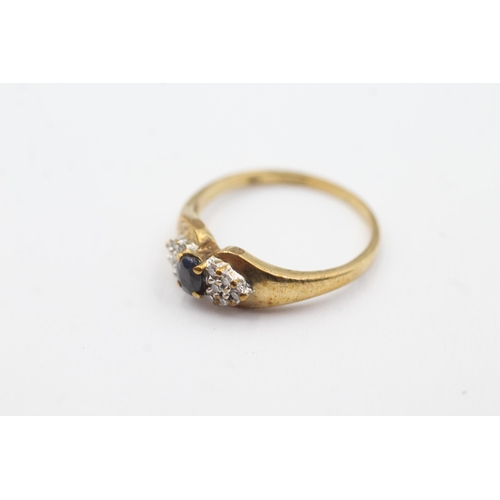 259 - 9ct gold diamond sided sapphire ring (2.1g)  Size  M