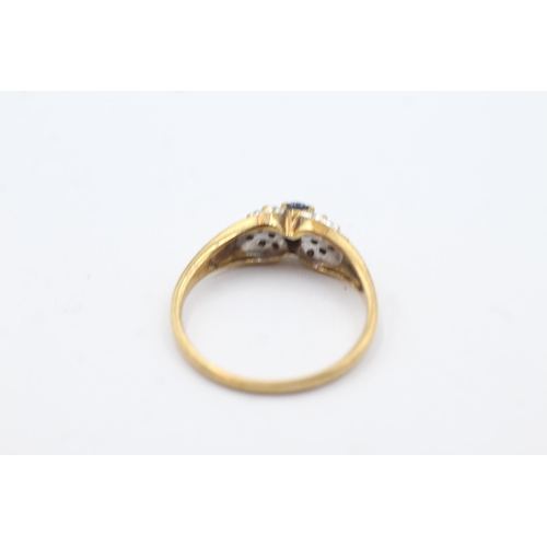 259 - 9ct gold diamond sided sapphire ring (2.1g)  Size  M