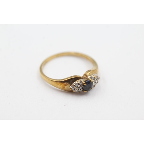 259 - 9ct gold diamond sided sapphire ring (2.1g)  Size  M