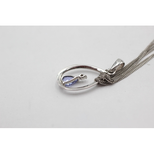 287 - 9ct white gold tanzanite & diamond pendant on chain (1.1g)