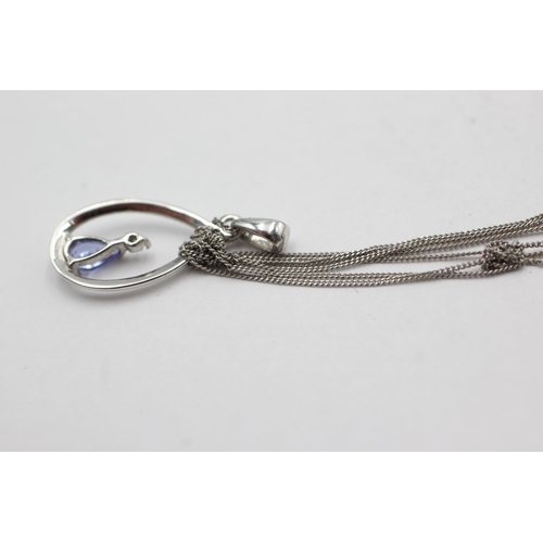 287 - 9ct white gold tanzanite & diamond pendant on chain (1.1g)