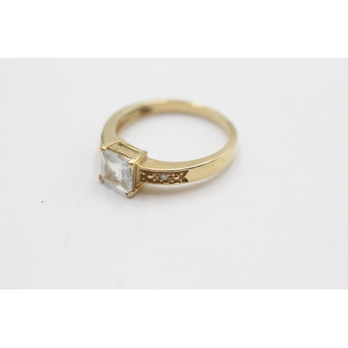 299 - 9ct gold diamond sided aqua ring (2.5g)  Size  N