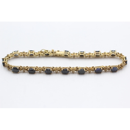 305 - 9ct gold sapphire & diamond tennis bracelet (9.9g)