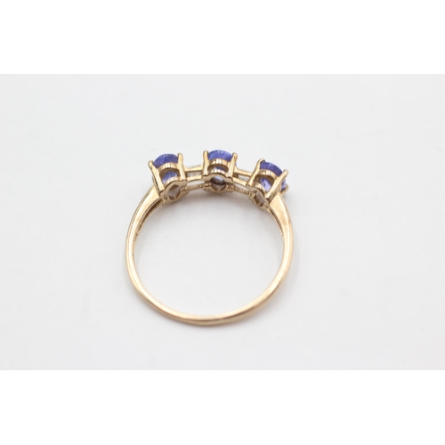 74 - 9ct gold diamond & tanzanite ring (2.1g)  Size T