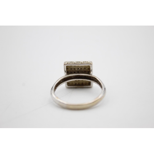 103 - 9ct white gold diamond cluster ring (4.4g) Size S