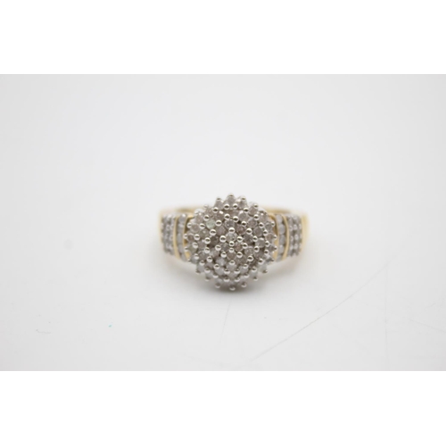 106 - 9ct gold diamond cluster ring (5.9g) Size R