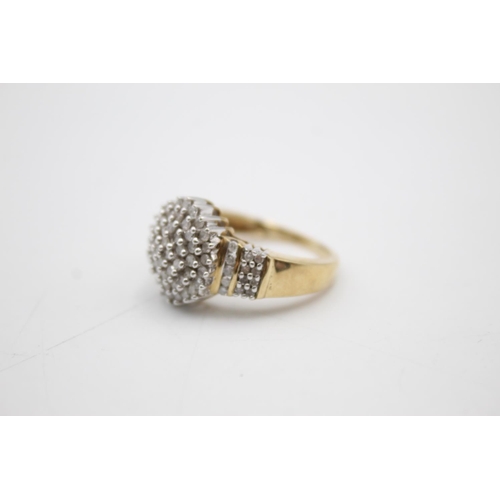 106 - 9ct gold diamond cluster ring (5.9g) Size R