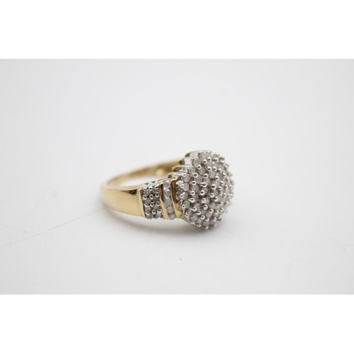 106 - 9ct gold diamond cluster ring (5.9g) Size R