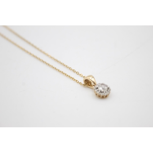 114 - 9ct gold diamond pendant necklace (1.9g)