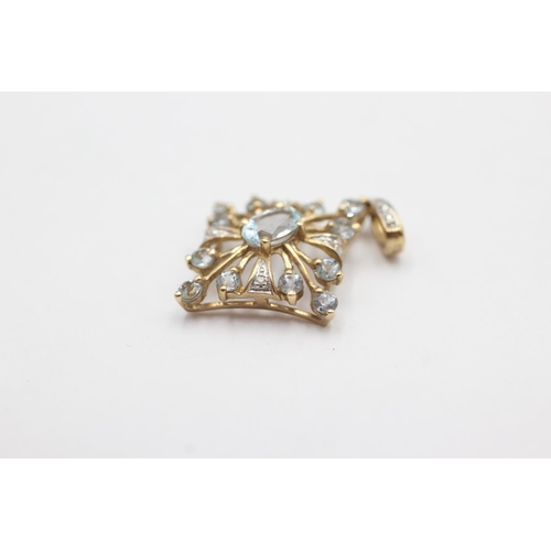 39 - 9ct gold aquamarine & diamond openwork pendant (1.8g)