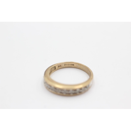 42 - 9ct gold diamond channel setting ring (2.5g) Size L