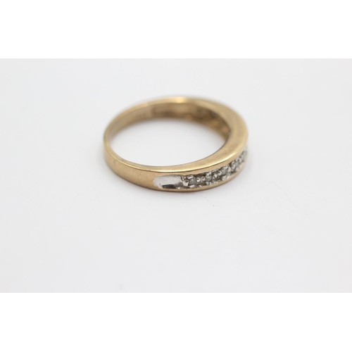 42 - 9ct gold diamond channel setting ring (2.5g) Size L