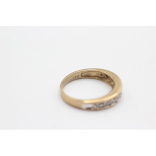 42 - 9ct gold diamond channel setting ring (2.5g) Size L