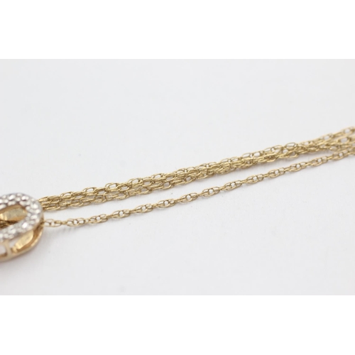 87 - 9ct gold brown gemstone & diamond pendant necklace (3.1g)