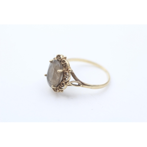 1 - 9ct gold vintage smokey quartz set in a scrolling framed dress ring - size n1/2 (2g)