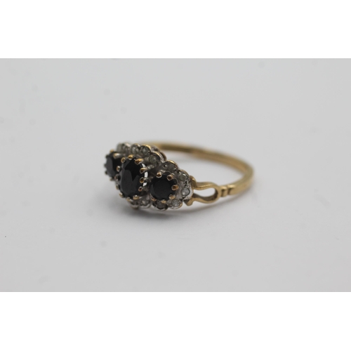 51 - 9ct gold sapphire three stone ring with diamond accents (2.5g) Size   O