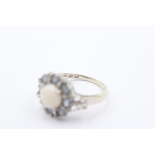 52 - 9ct gold opal & sapphire halo ring (3.8g) Size   Q