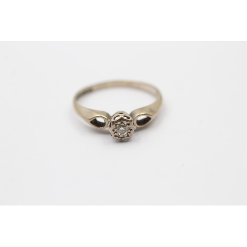 63 - 9ct gold round brilliant cut diamond solitaire ring with openwork shanks (2.4g) Size   M