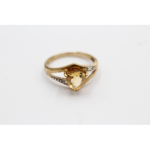 64 - 9ct gold trillion-shaped citrine solitaire ring with split diamond set shank (2.6g) Size   N