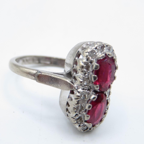 111 - 18ct gold ruby and diamond figure 8 ring  6g  size K