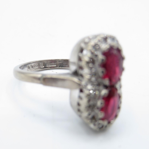 111 - 18ct gold ruby and diamond figure 8 ring  6g  size K