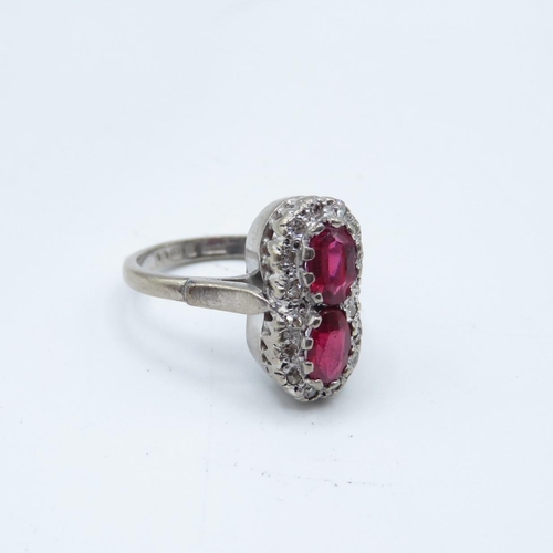 111 - 18ct gold ruby and diamond figure 8 ring  6g  size K