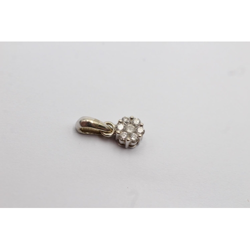 27 - 14ct white gold diamond cluster set pendant (0.7g)