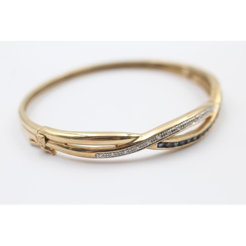 45 - 9ct gold sapphire & diamond twist band round bangle (10.5g)