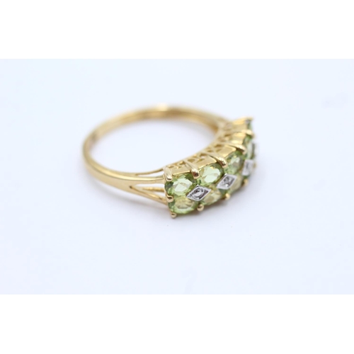 79 - 9ct gold peridot and diamond set double row ring - size p (2.7g)