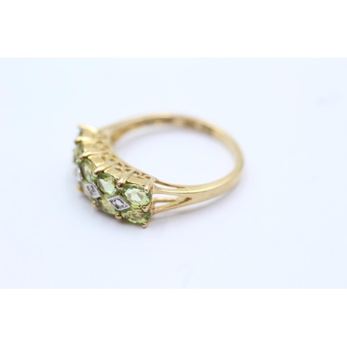 79 - 9ct gold peridot and diamond set double row ring - size p (2.7g)