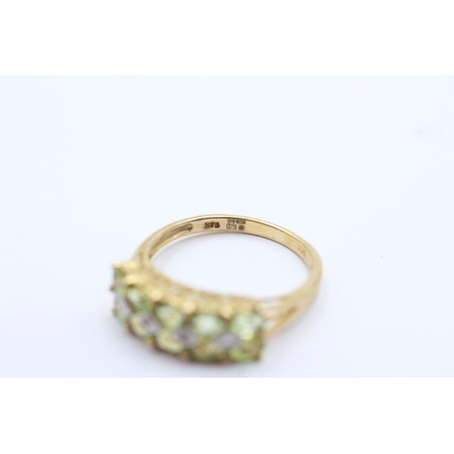 79 - 9ct gold peridot and diamond set double row ring - size p (2.7g)