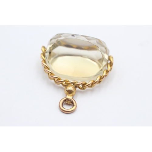 123 - 9ct gold citrine spinner fob (13.4g)