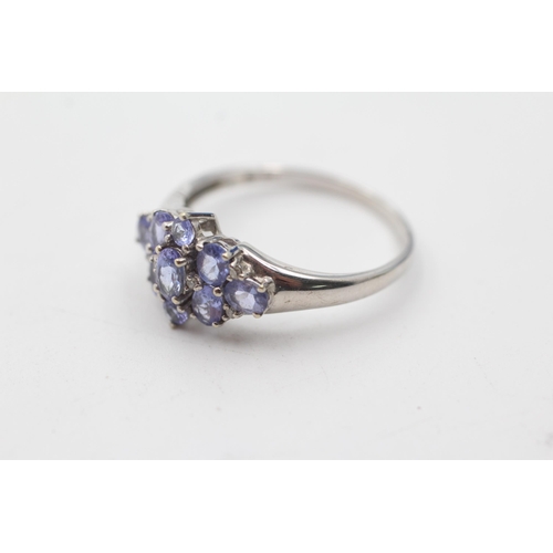 128 - 9ct white gold diamond & tanzanite cluster ring (2.9g) size  V