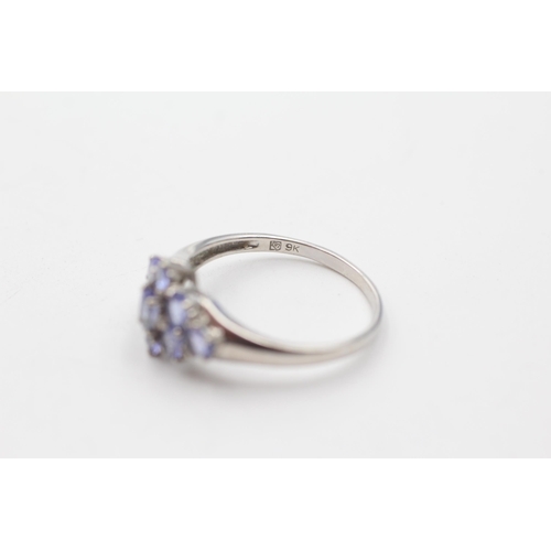 128 - 9ct white gold diamond & tanzanite cluster ring (2.9g) size  V