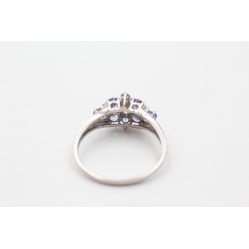 128 - 9ct white gold diamond & tanzanite cluster ring (2.9g) size  V