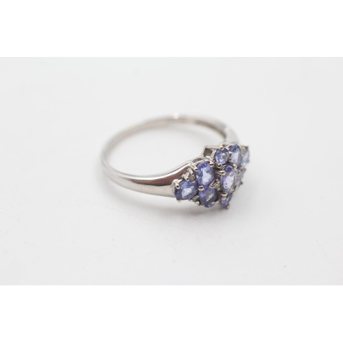 128 - 9ct white gold diamond & tanzanite cluster ring (2.9g) size  V