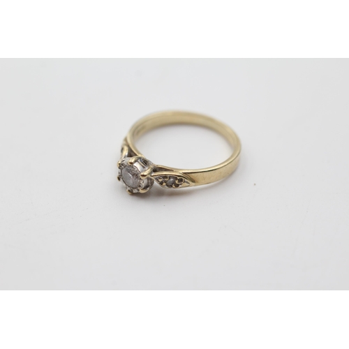 142 - 9ct gold diamond solitaire dress ring with shoulder accents (2.1g) size  K