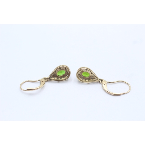 145 - 9ct gold paired diamond and peridot, drop earrings (2.1g)